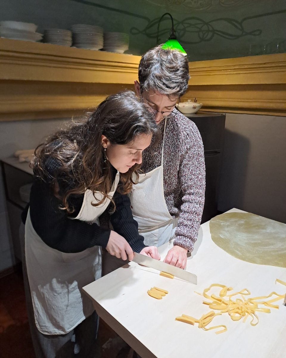 Vero teaching a guest to cut tagliatelle by hand at davVero, Bologna